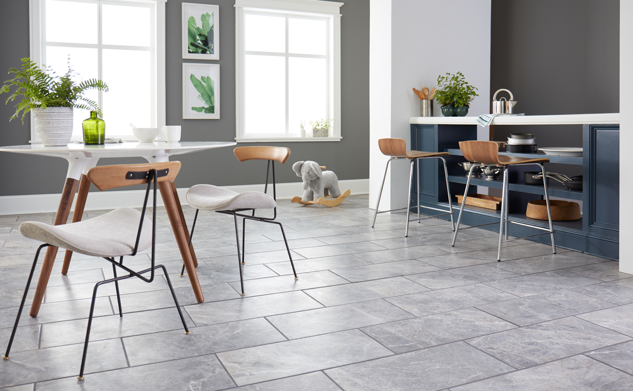 Subway tile on a floor in a casual grey dining room 